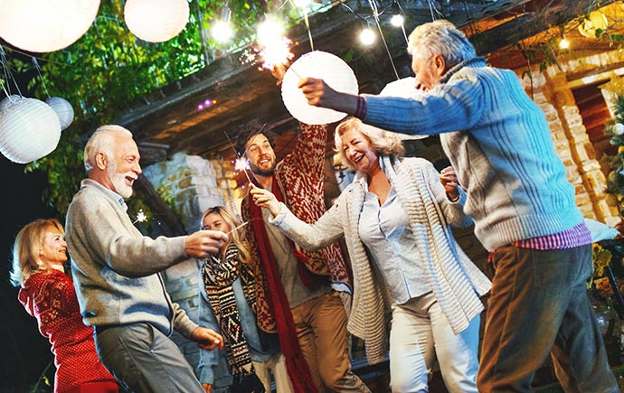 Retired couples having a dinner party and dancing.